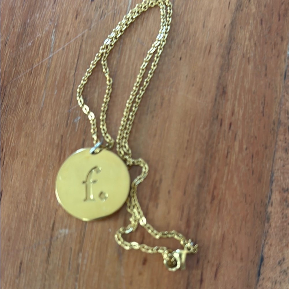 Gold Necklace with Circular Pendant with the word Gratitude